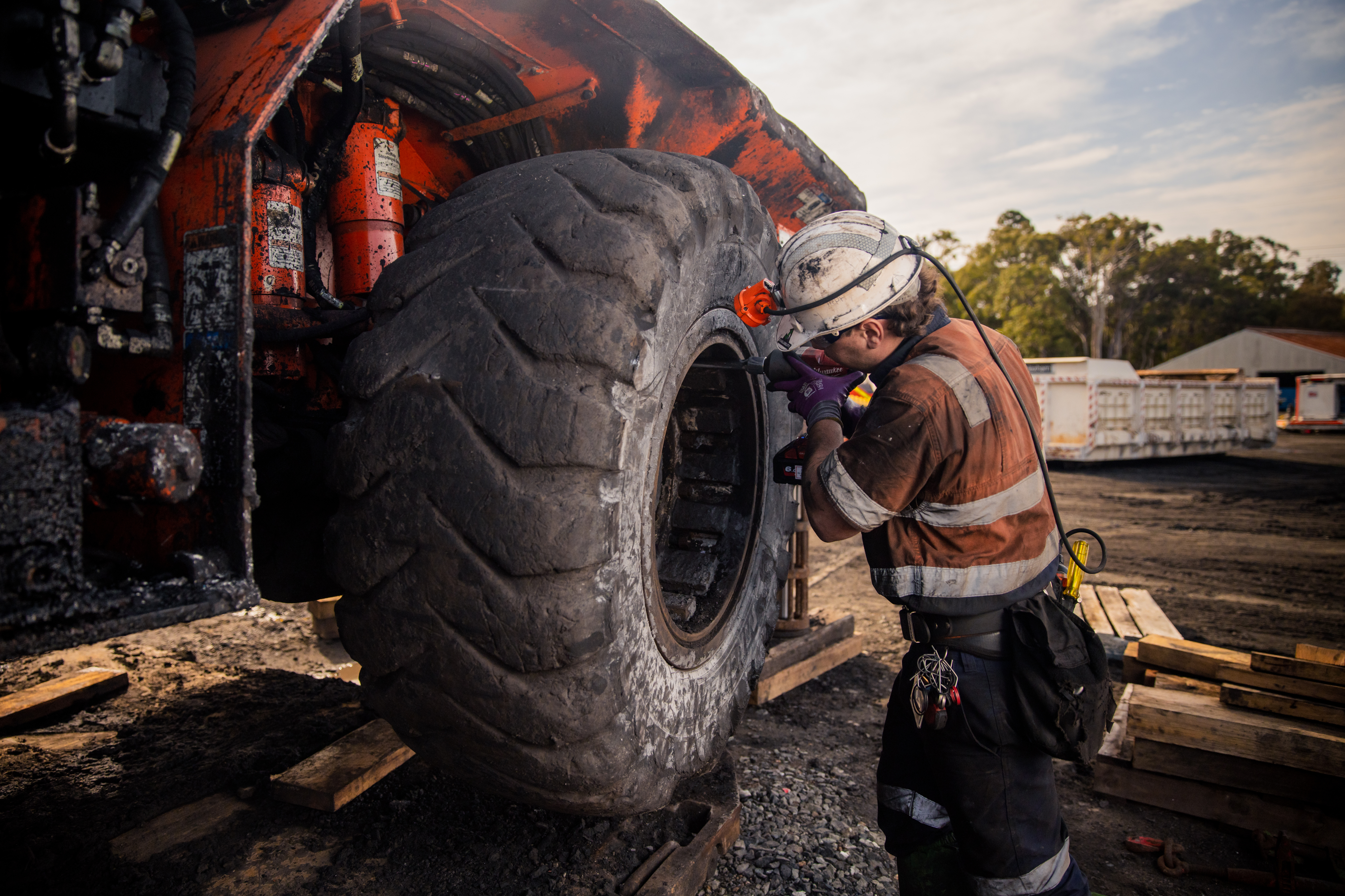 New Legislation Web Banner Mine workers discussing tasks next to a truck